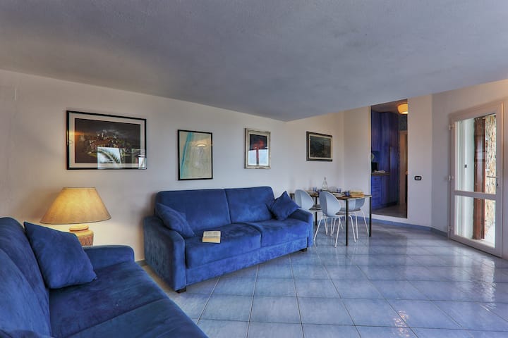 Living room with dining table and  sofa bed