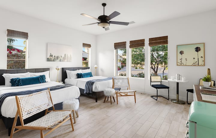 Casita with 2 queen beds and plenty of room for sitting and relaxing. Features a kitchenette area with microwave, fridge coffee pot, sink, small bistro table with 2 chairs (can also be a work area), walk-in closet, separate bathroom, and Smart TV.