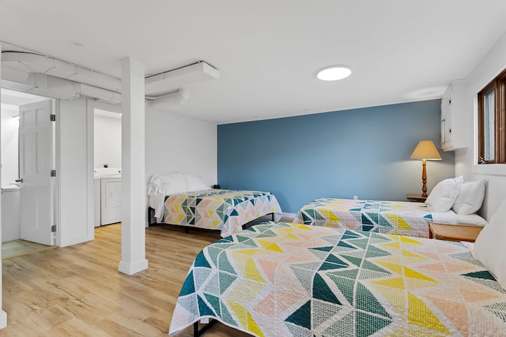 Basement features its own newly renovated bathroom, laundry facilities, full bed, and two twin beds