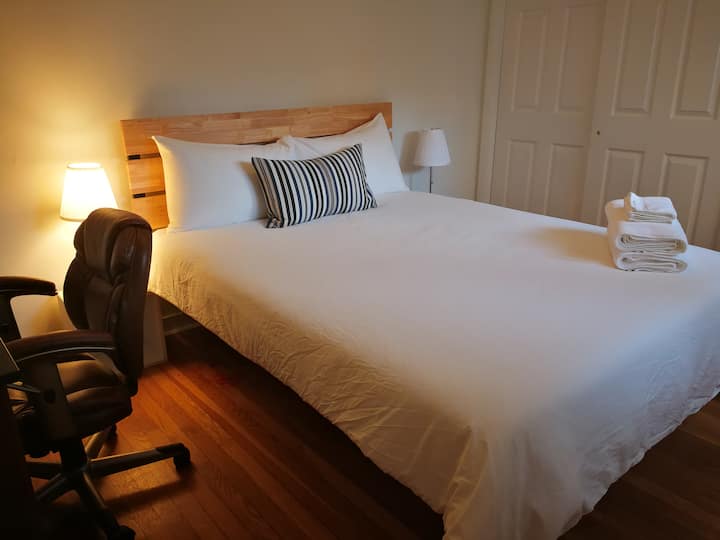 3rd bedroom and our master bedroom with a small desk, office chair. Queen bed with closet!