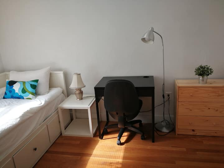 Bedroom 2 with desk and office chair.