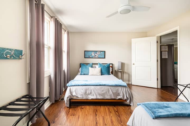 Bedroom 2 with 2 queen beds. Access to the private deck overlooking the back yard