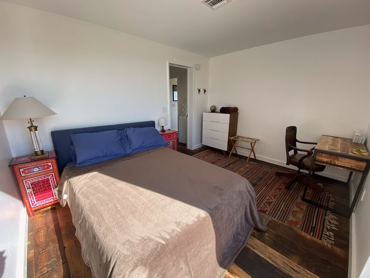 There's a desk in bedroom one