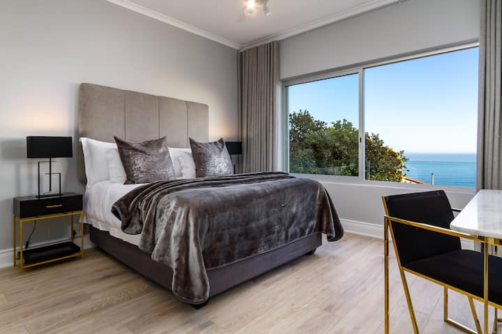 The main bedroom offers a queen sized bed and stunning ocean views.