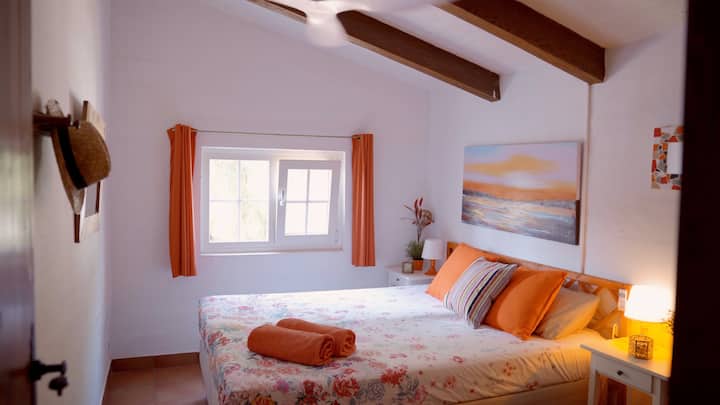 The orange room with a big double bed 
