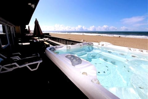 Ultimate Beachfront retreat with hot tub and views