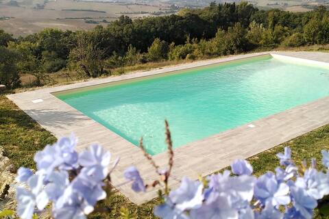 Typical farmhouse with swimming pool in the green Umbrian hills