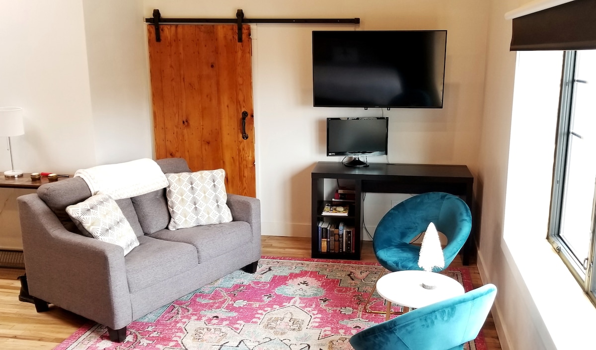 55 inch smart TV with free wifi; workspace; locked barndoor entrance to Klokkenspel bell tower