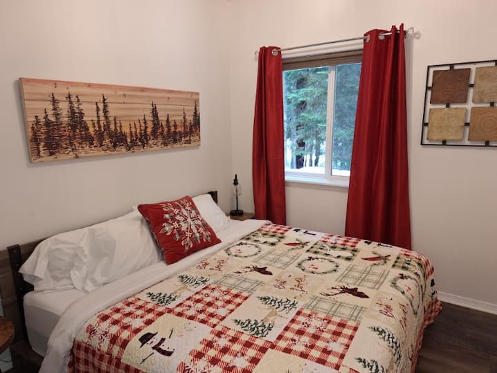 Bedroom 2 as seen from the doorway.  Notice the lovely forest seen out the window.