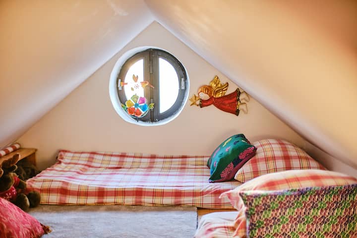 The kids' room is cozy and offers the owner's collection of toys to talk to