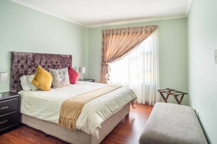 Bedroom 1. Spacious, North facing window and warm. With queen bed and  viewed from doorway