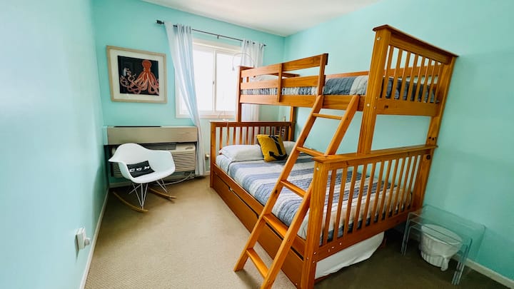 Kid's BR. Twin over Full bunkbed with single trundle under (pack n' play in the closet). 