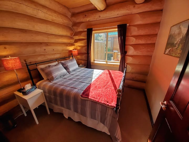 Main floor queen bedroom in summer.