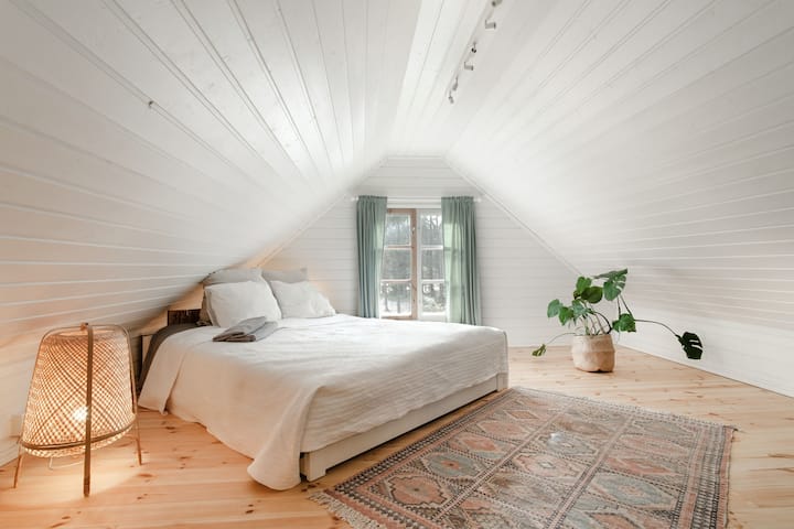 The charming upstairs king bedroom