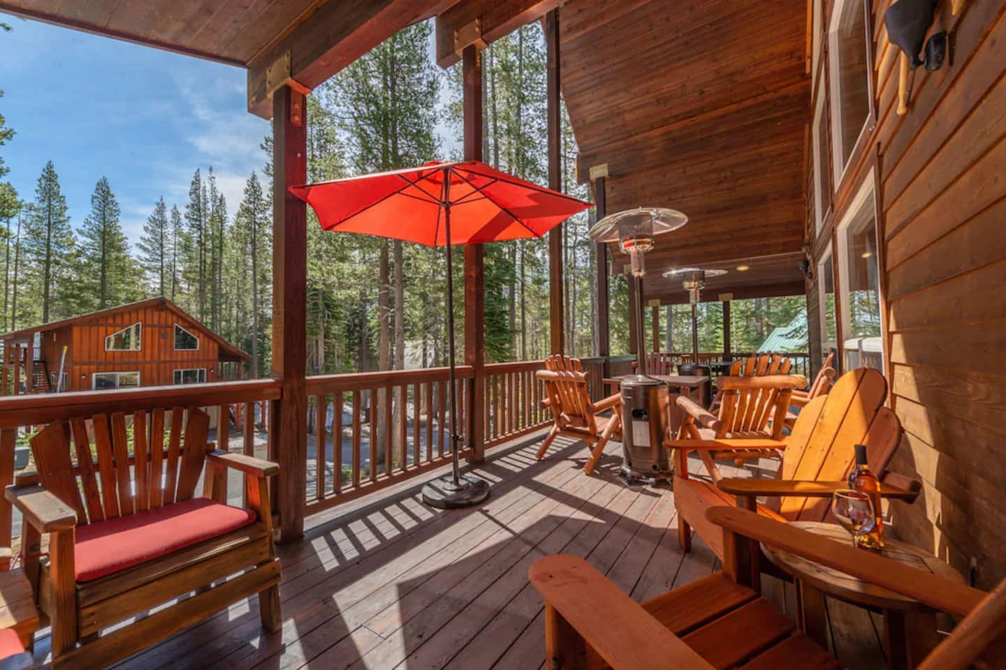 Spacious front deck that wraps around both sides of the house