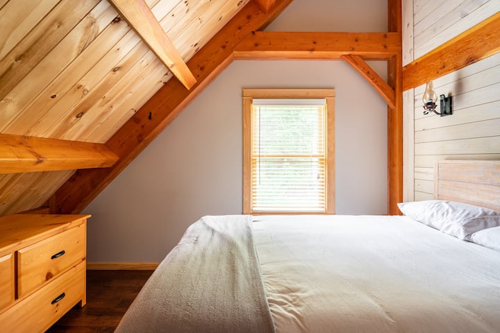 Bedroom #2 located on the second floor, with vaulted ceiling and a Big Ass fan.  "Big Ass" is the name of the company. Best fans on the market. :) 