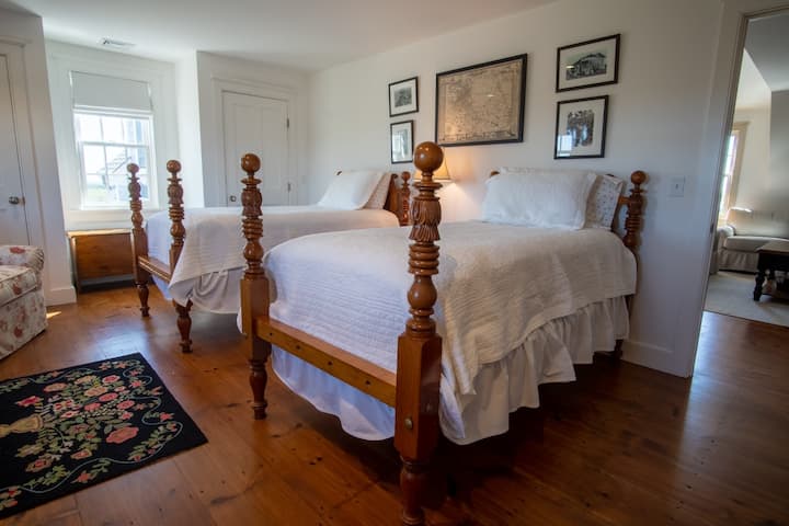 The second bedroom located off the second floor living area features 2 twin beds.