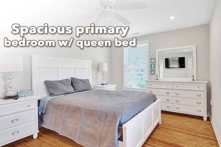 This is the primary bedroom on the second floor featuring a queen bed, 2 dressers, a TV, and a full closet.