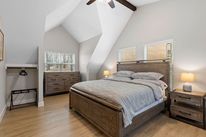 There are two-bedroom suites on the upper level.  Each bedroom has a king size bed and a smart TV. There is also a single roll out mattress.