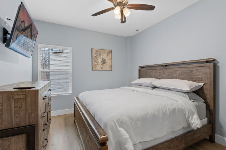 There are two bedrooms on the lower level. Each bedroom has a king size bed and a smart TV.