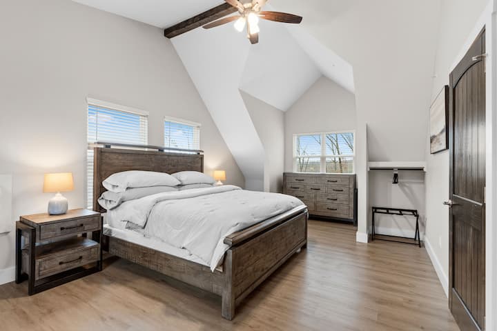 There are two-bedroom suites on the upper level.  Each bedroom has a king size bed and a smart TV. There is also a single roll out mattress.