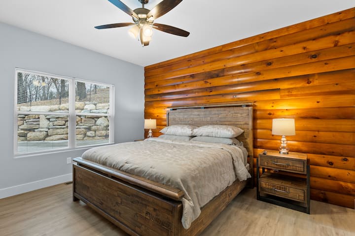 This main level bedroom suite has a king size bed and a smart TV.