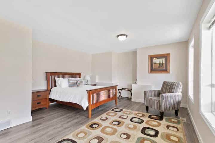 Bedroom 3 on the main level with a queen bed.