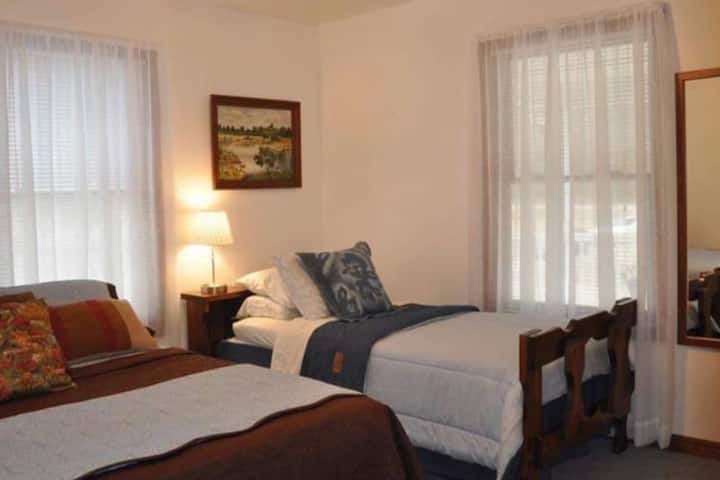 Bedroom #2 is in the Lodge, which is the main house. It has a queen and a single bed. This room is by the kitchen.