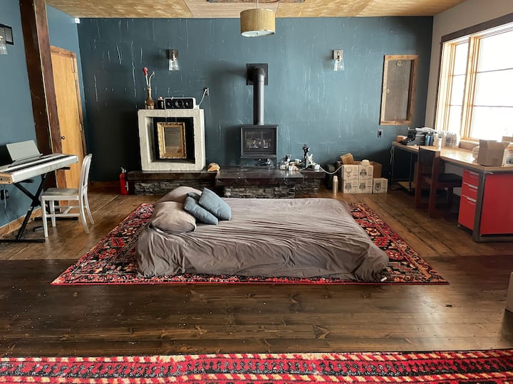 Bedroom/Private Suite | Downstairs
Optional private downstairs Suite w/ up to 3 queen-size floor beds. Includes indoor fireplace, TV, & in-suite laundry. Separate entrance from main house. *$250 per night if you would like to use this private suite* 