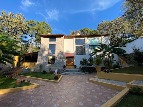 House with a pool and entertainment space