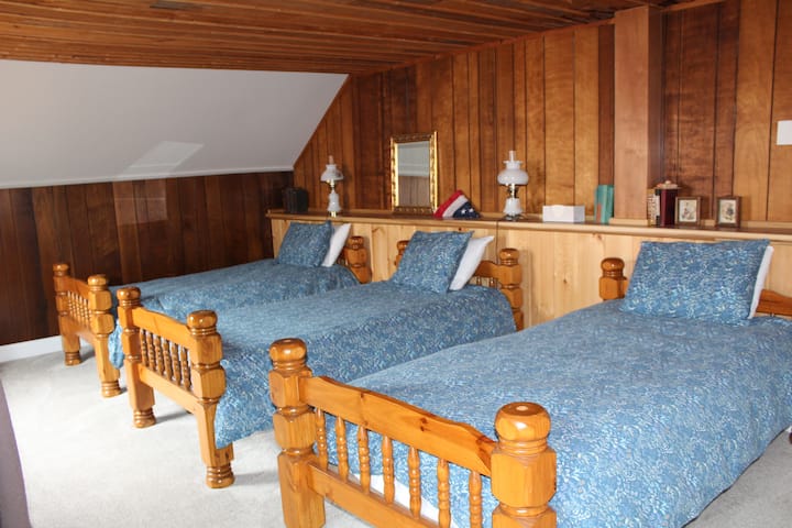 Room 9 - three twin beds (one of three bedrooms on the third floor).  *This bedroom does not have an en suite bathroom, the dedicated bathroom for this room is the hall bath on the third floor (newly renovated w/ custom tile shower and heated floor