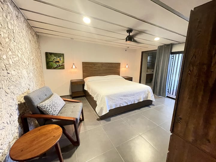 The second room has a comfy king-size bed and a private bathroom. And direct access to the covered terrace.