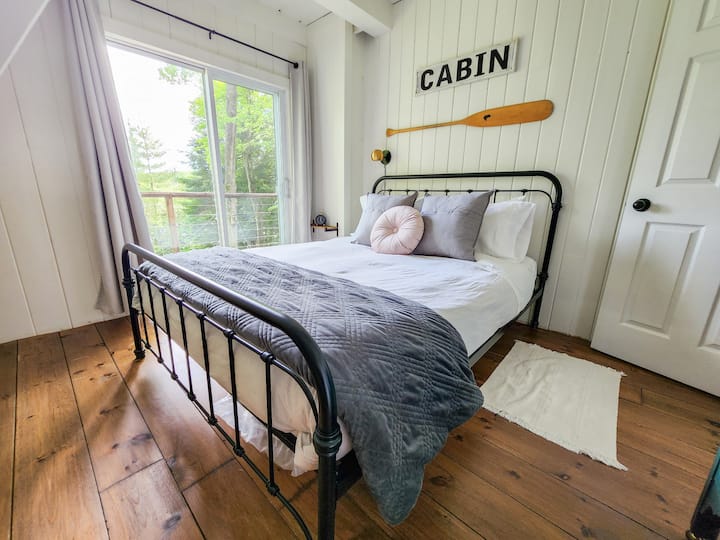 One of two Queen sized beds with walk out to balcony over looking the lake