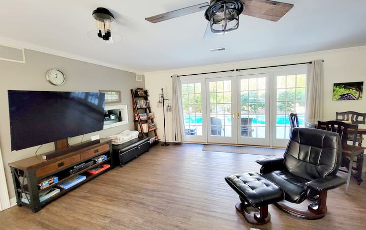 65" television

Board games, card games, dominoes, puzzles.

The ottoman opens up for a twin sleeper.  There are two of these in the family room.