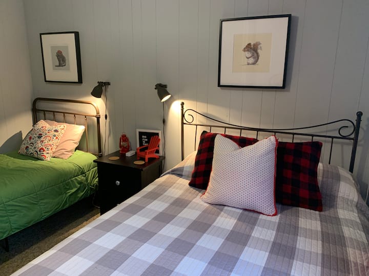 Our "Canadiana" room - one single and one double bed.