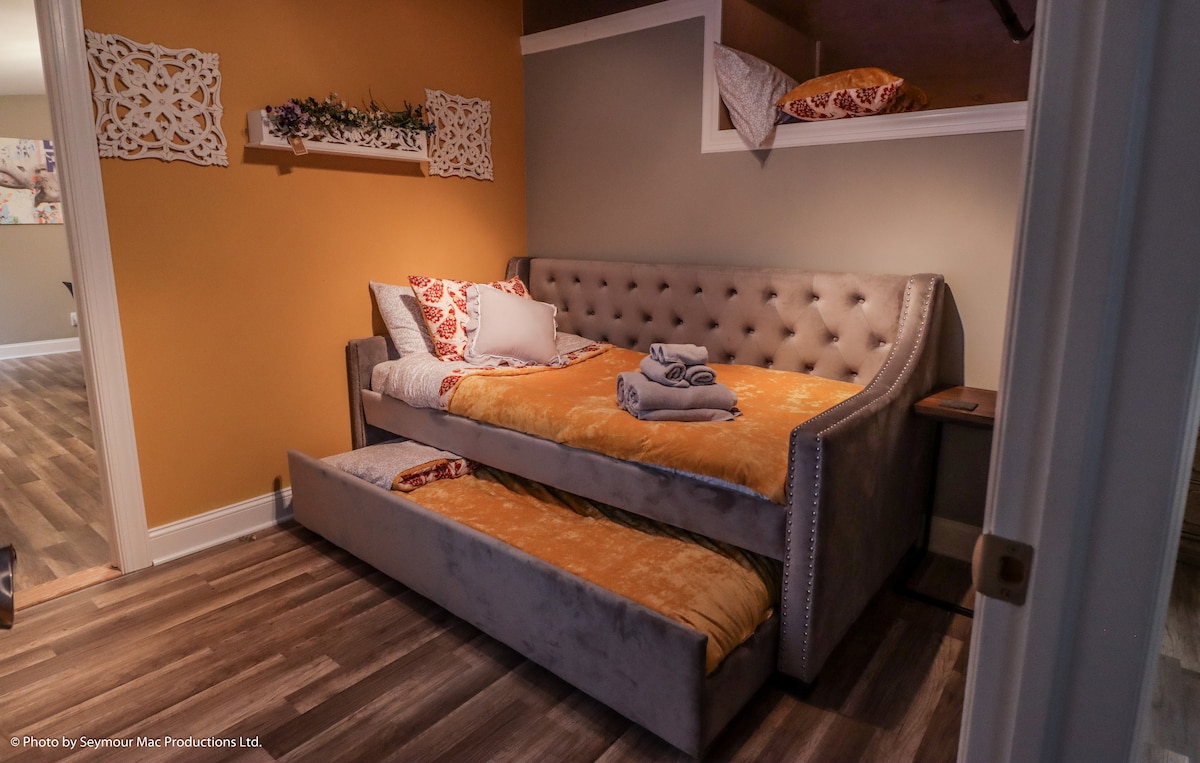 Bedroom four offers a chesterfield style day bed with two twin beds