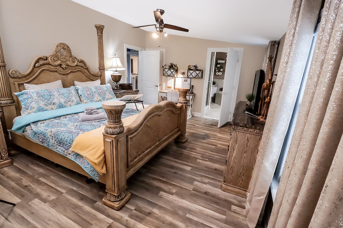 The grand master bedroom with a stunning four poster king bed