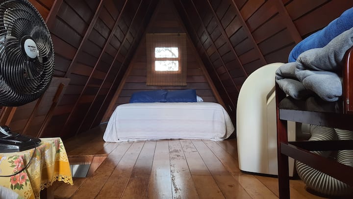 Double bed in the upper bedroom