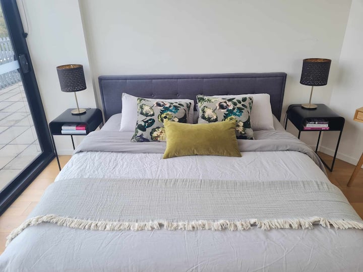 King size bed.  Bedroom has direct access to balcony.  Room includes large robe and desk for those with some work to do.