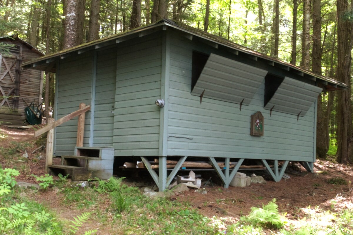 Cabin A Exterior, Shutters partially open.