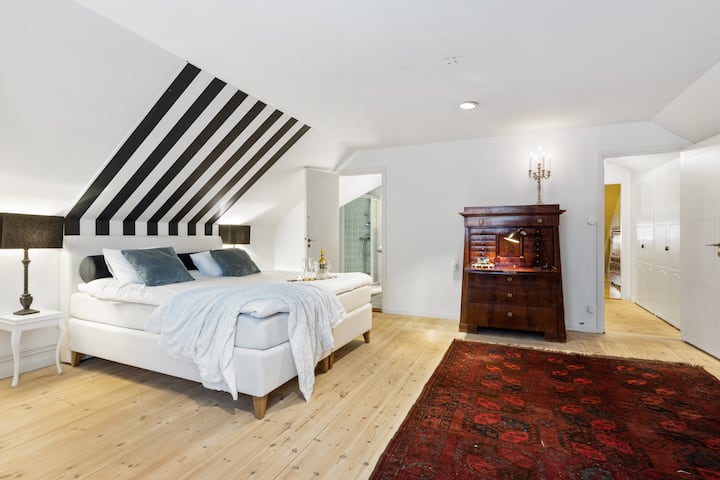 master bedroom with en suite and small balcony