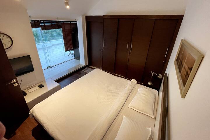 Third bedroom on upper deck 

Photo taken by guest, Keerti on 12 July 2021. 

Flooring is now marble aesthetic.

All mattresses follow a consistent setup with gentle leg elevation, designed for relaxed rest & support circulation.