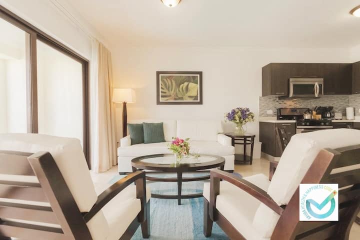 Bright and spacious living room with direct views of the main patio and pool ️️ Relax in comfort ! Whether you're sipping your morning coffee or winding down after a beach day, this cozy space is perfect for making memories.  