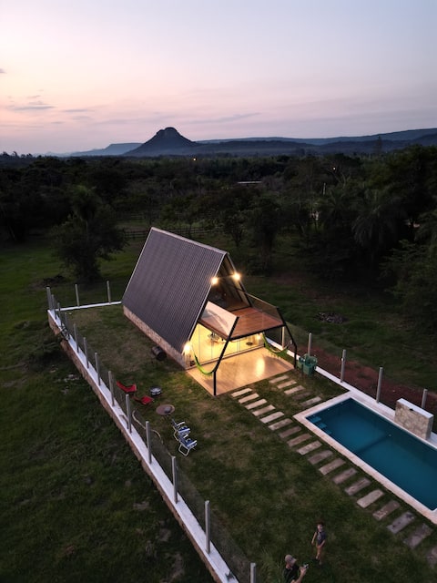 Alpine cabin between hills