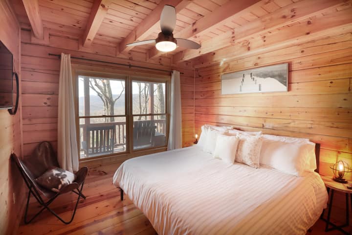 King bed in private lower bedroom with beautiful mountain views