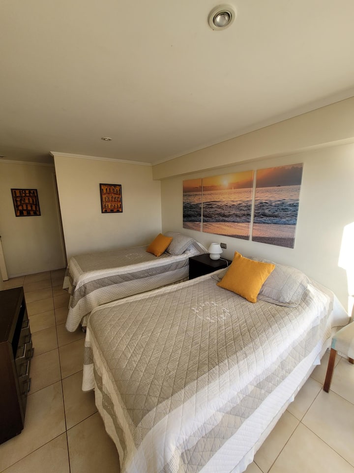 Bedroom 3. With 2 trundle beds, that is, up to 4 beds, private bathroom and closet. Ocean view and patio exit.
