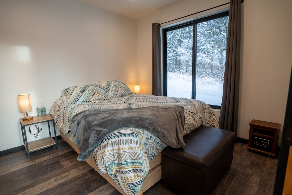Downstairs bedroom with cozy queen bed