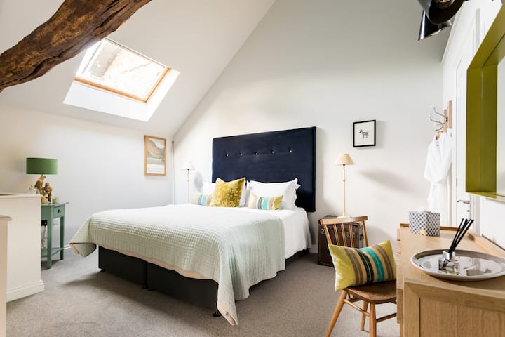 The Loft: Vaulted Ceilings, Beams, Quirky Decor.