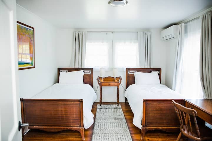Twin Bedroom: as charming as they come, our twin room features exclusively antique furniture that feels as much a part of the house as the fireplaces. Each bedroom is also equipped with wall units that provide customizable A/C and heat!
