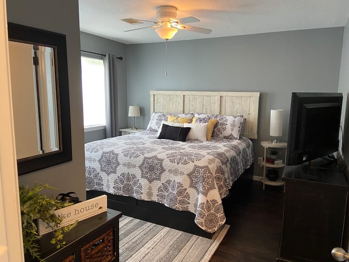 King bed in master with windows offering natural light.  Dresser, side cabinet and closet great for storage during your stay.  Large Smart TV with YouTube TV or use your personal accounts for streaming on Netflix, and other apps.
